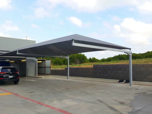 Commercial shade structure over a car wash bay