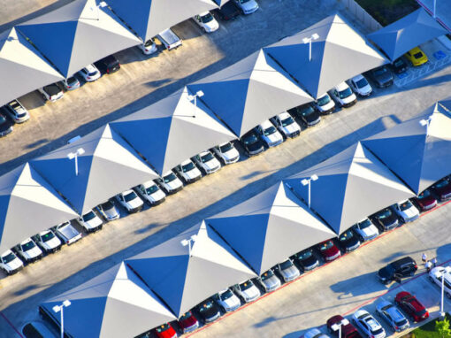 Aerial view of interlocking parking shade structures at Gunn Automotive in Live Oak, TX Aerial view of interlocking parking shade structures at Gunn Automotive in Live Oak, TX