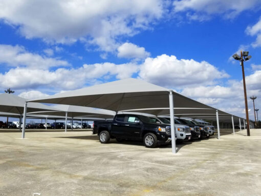 Commercial covered parking shade structure over parked vehicles
