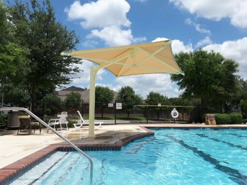 Cantilever shade structure over a community pool deck