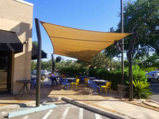Shade sail over restaurant patio seating
